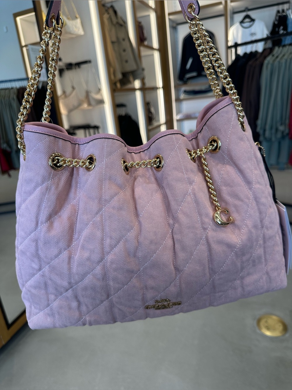 Coach Evelyn Shoulder Bag
In Loved Denim With Quilting And Charm